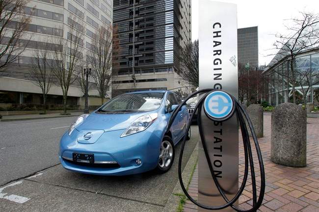 This March 31, 2011 file photo shows an electric charging station in downtown Portland, Ore.