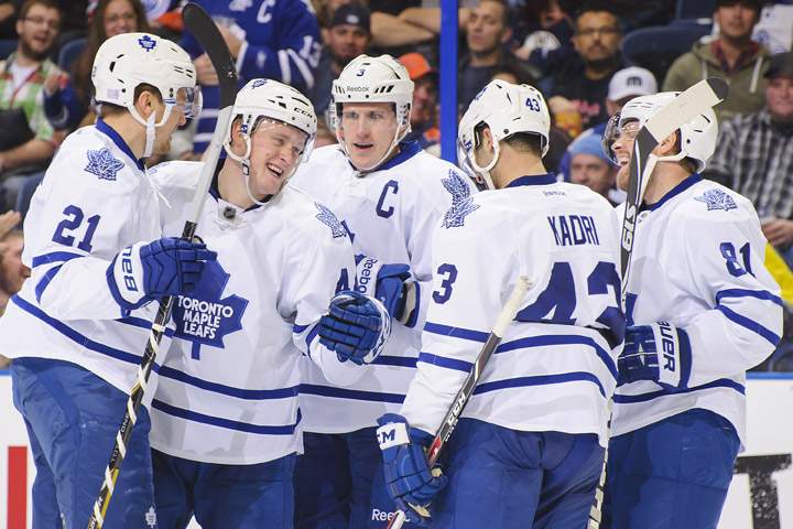 Nazem Kadri #43 of the Toronto Maple Leafs celebrates along with his teammates James van Riemsdyk #21, Morgan Rielly #44, Dion Phaneuf #3 and Phil Kessel #81 after scoring the team's fourth goal against the Edmonton Oilers during an NHL game on October, 29, 2013 at Rexall Place in Edmonton, AB, Canada.