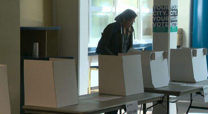 A NAIT student casts his ballot at an advance polling station Tuesday, October 15, 2013.