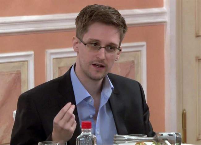 FILE - In this file image made from video released by WikiLeaks on Friday, Oct. 11, 2013, former National Security Agency systems analyst Edward Snowden speaks during a presentation ceremony for the Sam Adams Award in Moscow, Russia.