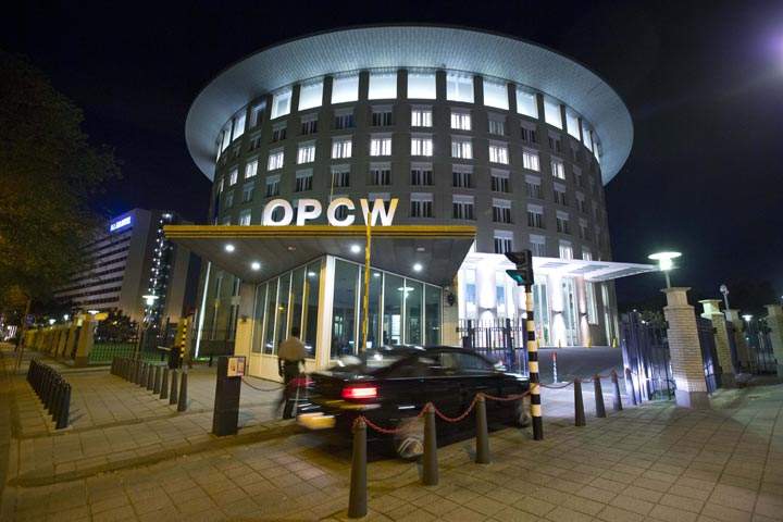 FILE - In this Friday Sept. 27, 2013 file photo a car arrives at the headquarters of the Organization for the Prohibition of Chemical Weapons, OPCW, in The Hague, Netherlands. 