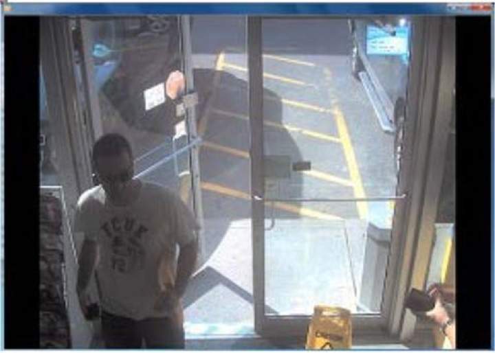 Police surveillance of Ford and Lisi with packages at a Scarlett Road gas station - image