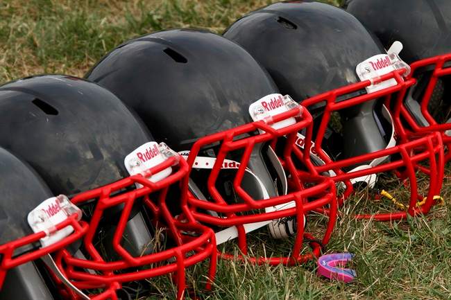 A New Brunswick high school football coach made the decision to forfeit a game at halftime after nine players suffered head injuries.