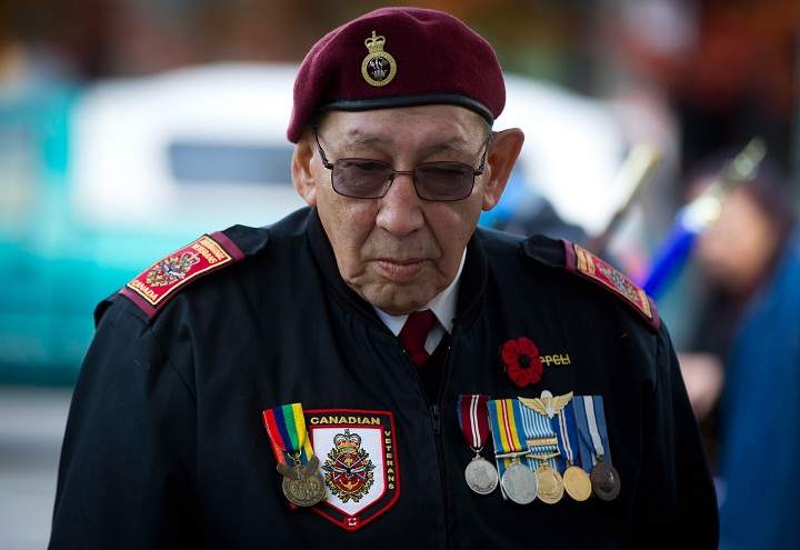 Korean War veteran Allen Derouin, 77, of the Ojibwe First Nation in Hudson, Ont., who served with the 2nd Battalion, Princess Patricia's Canadian Light Infantry, attends a National Aboriginal Veterans Day ceremony at the Victory Square Cenotaph in Vancouver, B.C., on Friday November 8, 2013. 