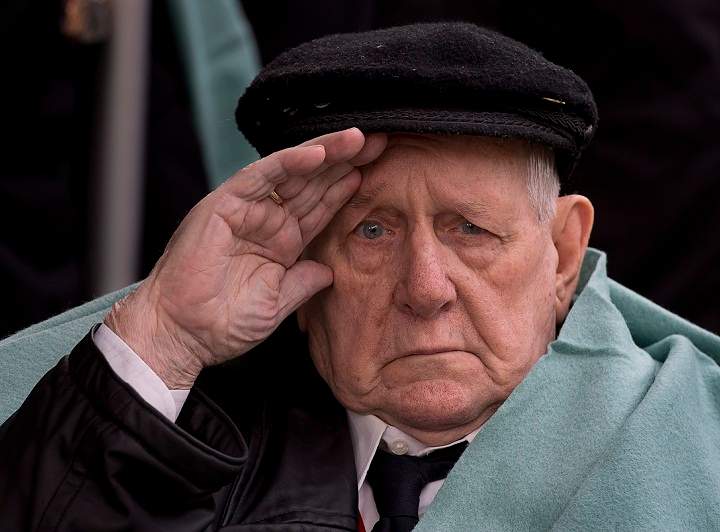 Allan Tanner, 88, salutes at the Remembrance Day ceremonies at the Grande Parade in Halifax on Monday, Nov. 11, 2013. (The Canadian Press/Andrew Vaughan)