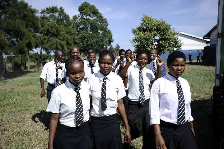 Students wait to talk with a counselor about HIV and AIDS prevention on March 8, 2011 outside a mobile clinic at Madwaleni high school near Mtubatuba in Kwazulu Natal, South Africa. A tiny prick made a drop of blood on Nkosi Minenhle's finger, as the 15-year-old underwent an HIV test in a mobile clinic set up on her high school grounds. Only a handful of organizations organize HIV tests in schools in South Africa, the country hardest-hit by the virus that infects 5.7 of the 48 million population.