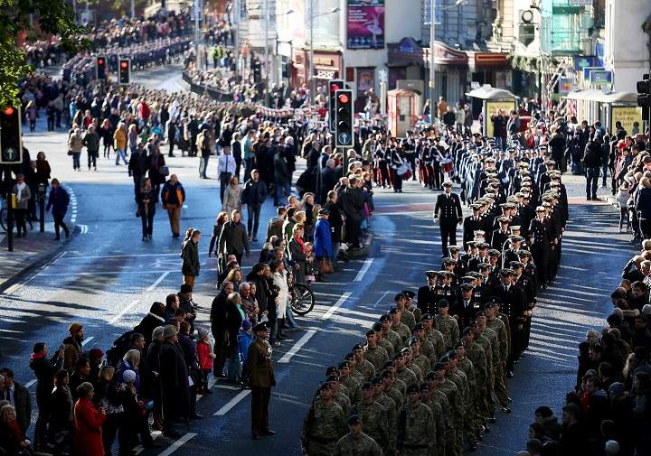 Locals line the street as members of the armed forces and veterans march during a Remembrance Day on November 10, 2013 in Bristol, England. People across the UK gathered to pay tribute to service personnel who have died in the two World Wars and subsequent conflicts, as part of the annual Remembrance Sunday ceremonies. (Matt Cardy/Getty Images)