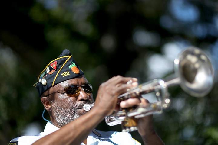 Cyril Bullard retired from the United States Army plays the trumpet during a Veterans Day ceremony at the Coconut Grove Bahamian cemetery on November 11, 2013 in Coconut Grove, Florida. (Joe Raedle/Getty Images)