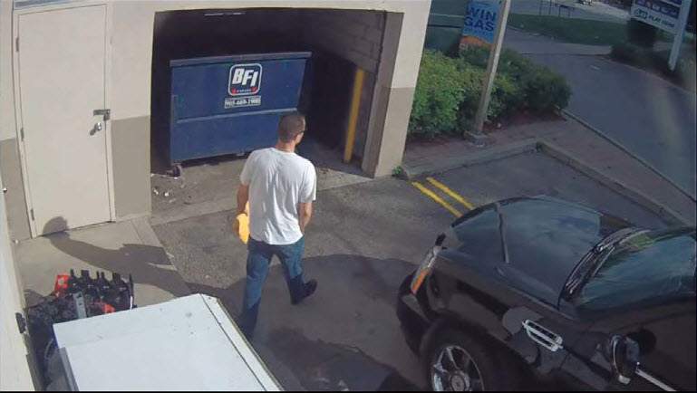 Police photo of Lisi near Ford's car.
