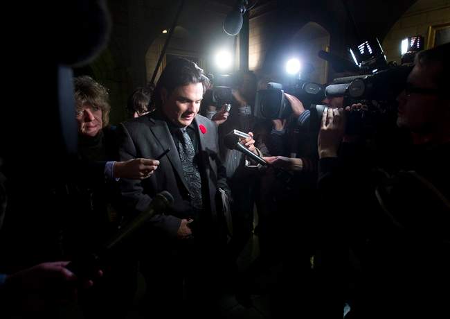 Sen. Patrick Brazeau makes his way to the Senate Thursday October 31, 2013 on Palriament Hill in Ottawa. 