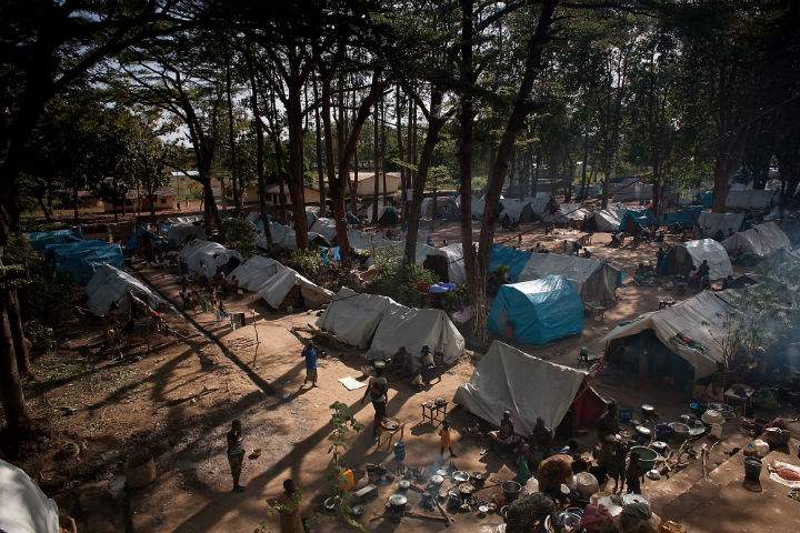 This picture taken on November 9, 2013 shows Internally Displaced Persons (IDP's) standing in a camp next to the Cathedral in Bossangoa, 380 km north of Bangui. 