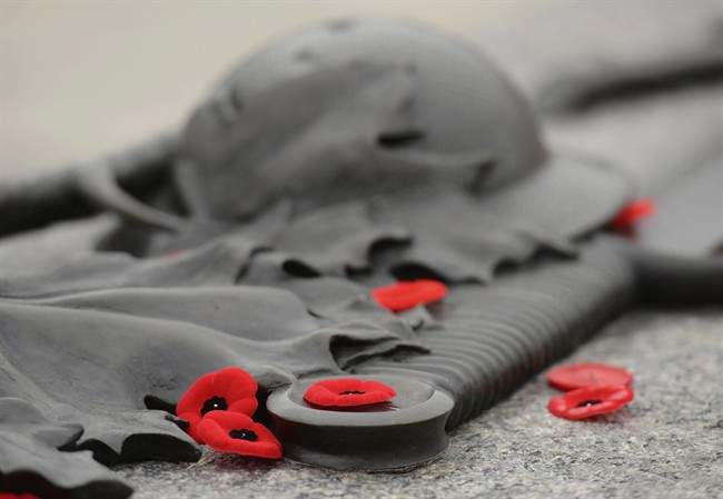 Poppies lie on the Tomb of the Unknown Soldier at the National War memorial.