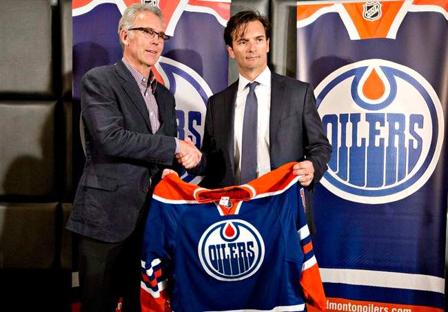 Edmonton Oilers general manager Craig MacTavish introduces the new head coach of the Edmonton Oilers, Dallas Eakins during a press conference in Edmonton, Alta., on Monday, June 10, 2013. 