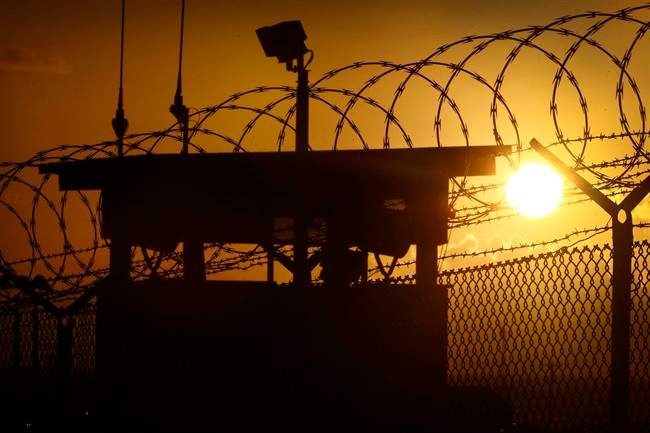 In this photo reviewed by the U.S. military, the sun rises above Camp Delta at Guantanamo Bay Naval Base, Cuba, Wednesday, Nov. 20, 2013. 