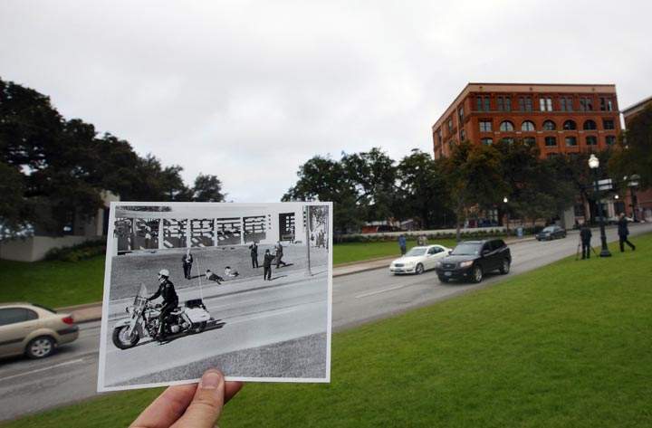 This Nov. 5, 2013 photo shows an image taken by Dallas Morning News photographer Tom Dillard on Nov. 22, 1963, of spectators lying on the ground in Dealey Plaza as a motorcycle police officer drives by immediately after the shooting of U.S. President John F. Kennedy, juxtaposed outside of the current day Elm Street, in Dallas. (AP Photo/Houston Chronicle, Cody Duty)