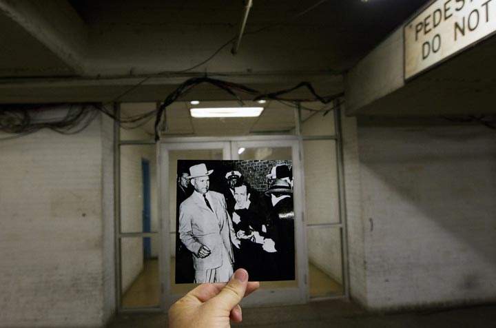 This Sept. 10, 2013 photo shows an image taken by Bob Jackson of the Dallas Times Herald on Nov. 24, 1963, of Lee Harvey Oswald, assassin of U.S. President John F. Kennedy, reacting as Dallas night club owner Jack Ruby, foreground, shoots at him from point blank range in a corridor of Dallas Police Headquarters, juxtaposed with the current scene at the Dallas Police Headquarters, in Dallas. (AP Photo/Houston Chronicle, Cody Duty)