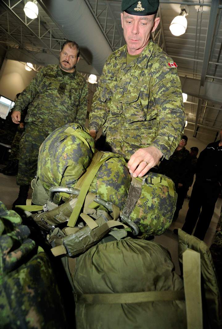 Master Warrant Officer David Milligan of a Disaster Assistance Response Team (DART) prepares his luggage for check-in at Canadian Forces Base Trenton on November 11, 2013.