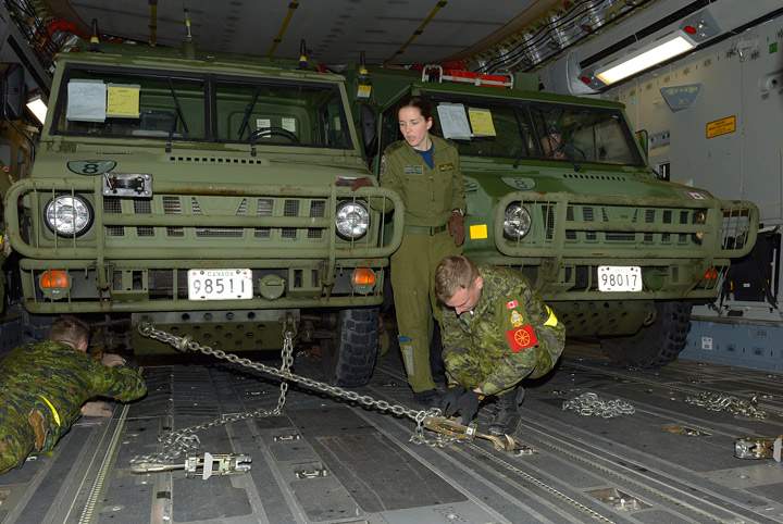 The advance party of the Disaster Assistance Response Team (DART) loads a C177 Globemaster bound for Hawaii at Canadian Forces Base Trenton on November 11, 2013 as Canada awaits recommendations from the Interdepartmental Strategic Support Team (ISST) and Humanitarian Assistance Reconnaissance Team (HART) on how best to assist the people of the Philippines.