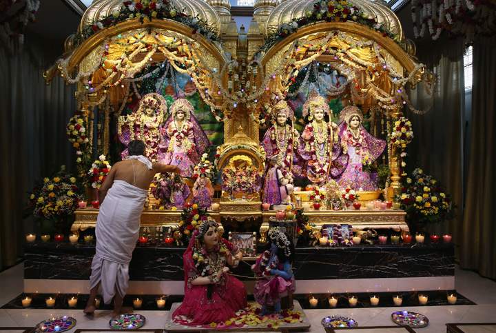 Offerings are made in the temple during Diwali celebrations at Bhaktivedanta Manor on November 3, 2013 in Watford, United Kingdom. (Photo credit: Getty Images)