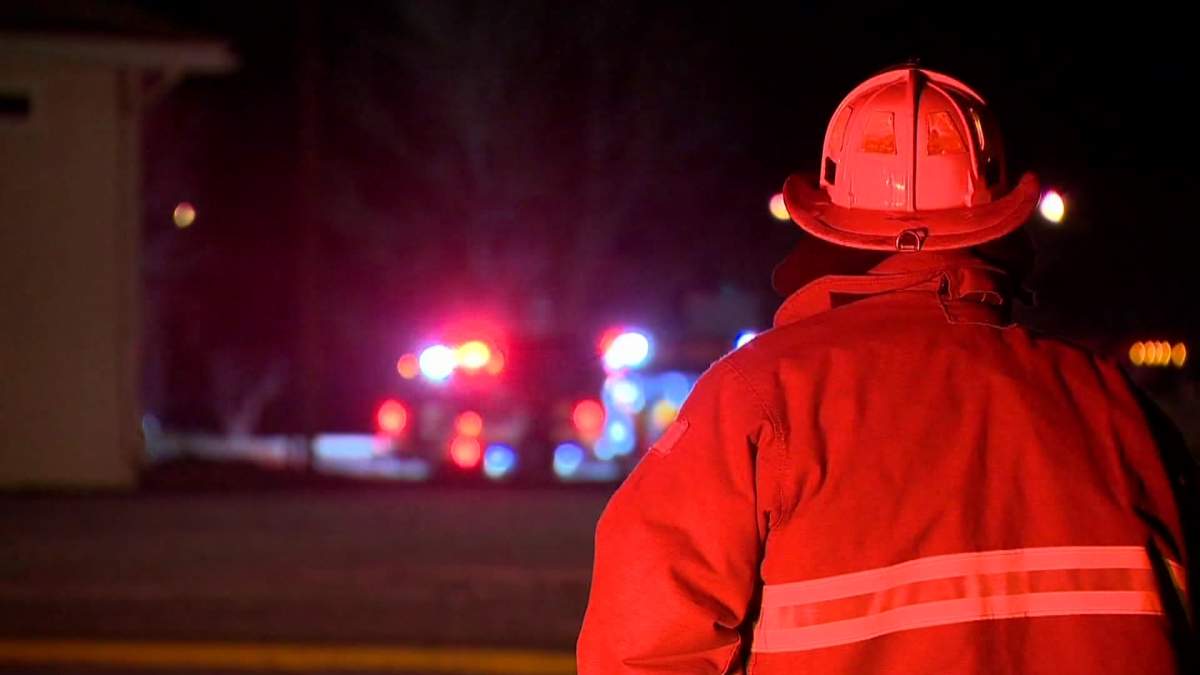 A file photo of a firefighter surveying the scene of an emergency call.  