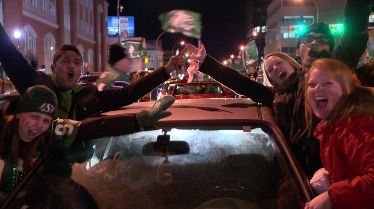 Fans cheer on Regina's Green Mile following the Saskatchewan Roughriders' Grey Cup win.