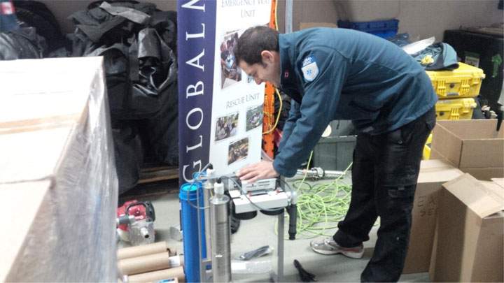 A member of GlobalMedic helps to load supplies destined for the Philippines from their warehouse in Toronto.