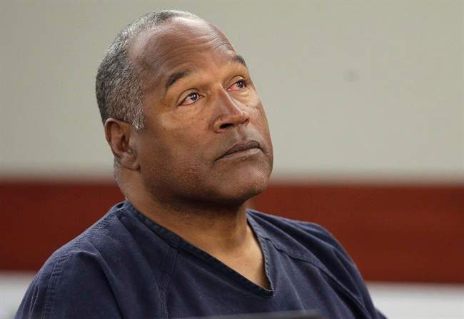 FILE - This May 13, 2013 file photo shows O.J. Simpson listening to testimony at an evidentiary hearing in Clark County District Court in Las Vegas.