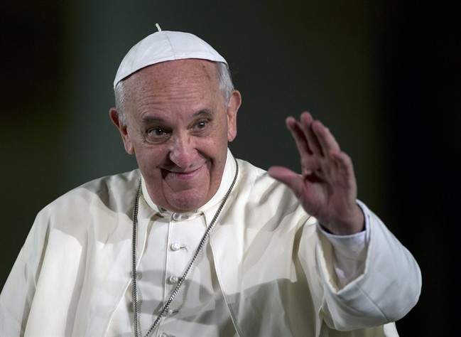 FILE - In this Saturday, Oct. 26, 2013 file photo, Pope Francis leaves after an audience with families in St. Peter's Square at the Vatican. 