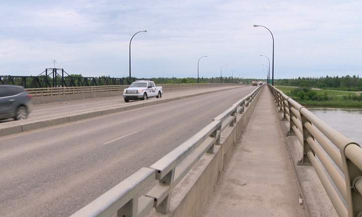 Single vehicle rollover leaves two injured on Diefenbaker Bridge in Prince Albert, Sask.