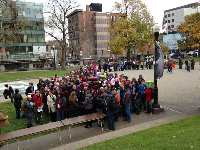 Hundreds of people wait in line to get a refund for their Hal-Con passes.