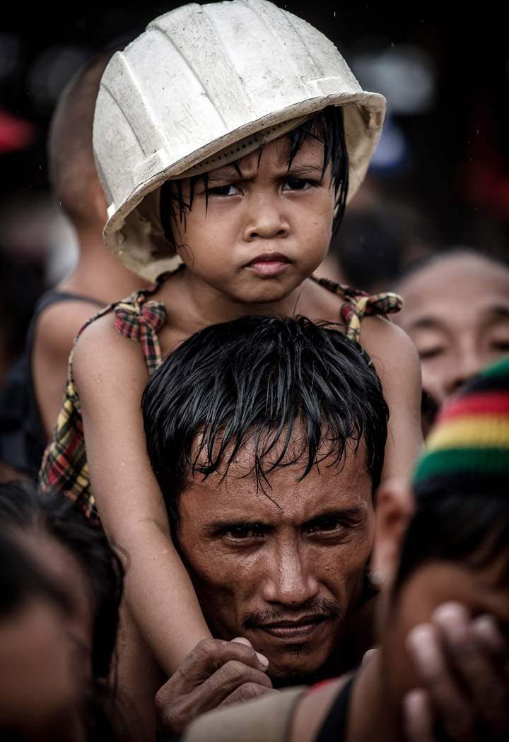 Typhoon victims wait to be evacuated at the airport in Tacloban, on the eastern island of Leyte on November 12, 2013 after Super Typhoon Haiyan swept over the Philippines. (Photo credit: Getty Images)
