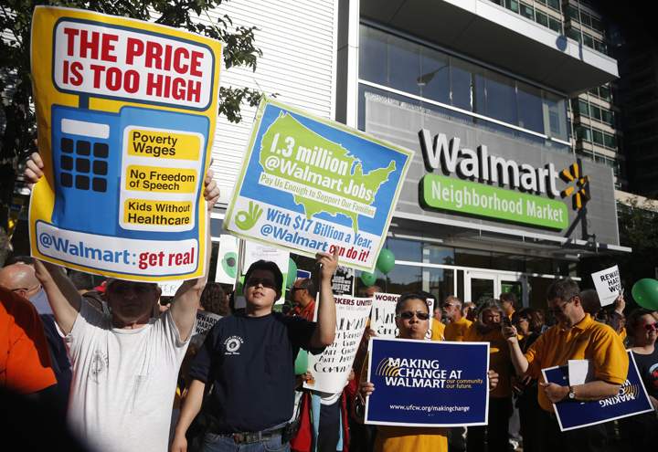Protesters gather outside a Walmart Neighborhood Store for a peaceful demonstration Thursday, Sept. 5, 2013, in Chicago. (Photo credit: AP Photo