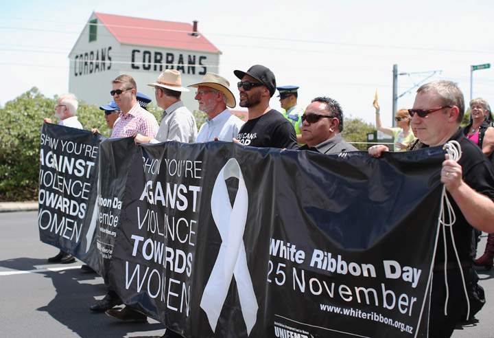 Protesters march to stop violence against women on November 25, 2013 in Auckland, New Zealand. The protest is one of a number of White Ribbon Day events taking place across New Zealand, urging citizens to take stand against violence towards women.