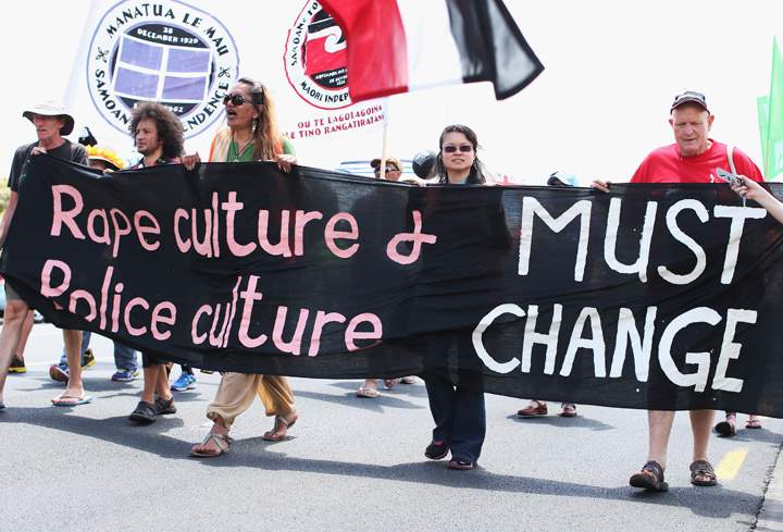 Protesters march to stop violence against women on November 25, 2013 in Auckland, New Zealand. (Photo credit: Getty Images)