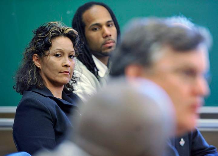 ilian Villanueva, mother of Fredy Villanueva, and Will Prosper, a Montreal north community activist, centre, listen to lawyer, Alain Arsenault, speak at a press conference in Montreal, Tuesday, May 26, 2009