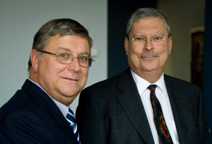 Quebec judge Robert Sansfacon, right, who will preside of the public inquiry into the shooting of Fredy Villanueva by a Montreal police officer, and prosecutor Francois Daviault pose for a photograph Wednesday, Dec. 3, 2008 in Montreal.