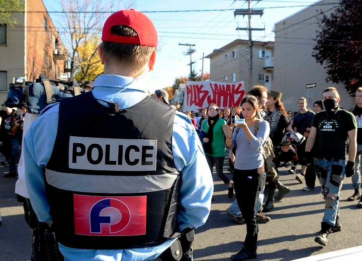 Demonstators take part in an anti-police brutality march Montreal, Saturday Oct. 11, 2008.