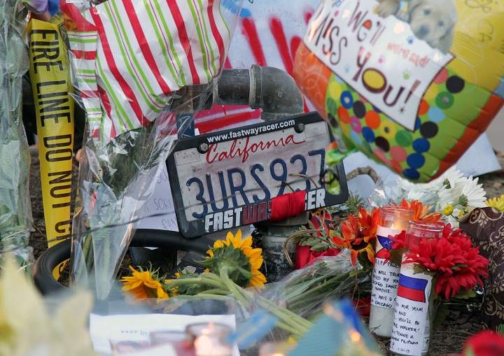 A general view of atmosphere as fans pay tribute to actor Paul Walker at the site of his fatal car accident on December 1, 2013 in Valencia, California. Walker died on November 30, 2013 at age 40.