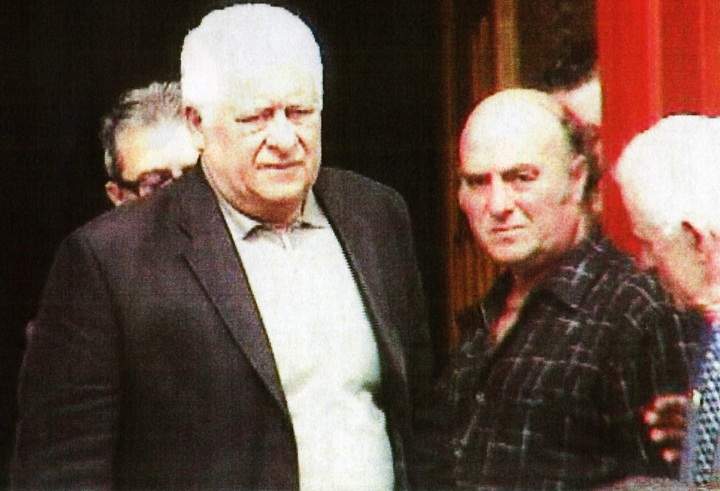 Agostino Cuntrera, wearing jacket and white shirt, is shown at the 2009 funeral for Domenico Macri.