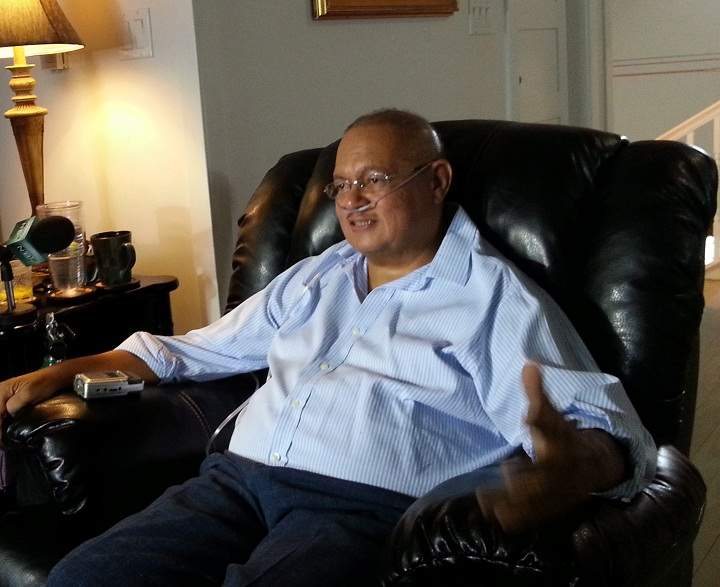 In this photo taken Saturday, March 2, 2013, Dr. Arthur Porter speaks with a reporter at his home in Nassau, Bahamas.