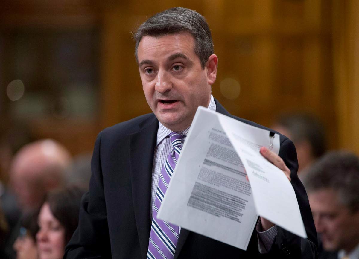 Parliamentary Secretary Paul Calandra responds to a question during Question Period in the House of Commons Tuesday December 3, 2013 in Ottawa. THE CANADIAN PRESS/Adrian Wyld