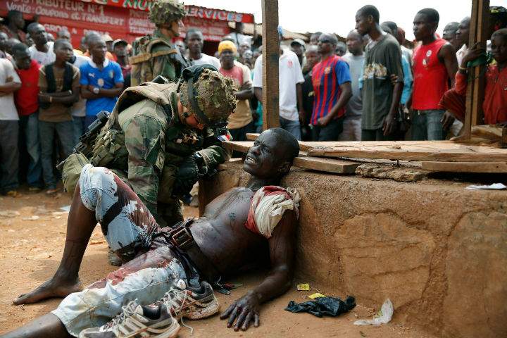 French soldier speaks to suspected Christian militia member in Bangui, Central African Republic