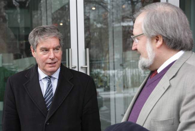 Lawyers for former Guantanamo Bay prisoner Omar Khadr, Dennis Edney (left) and John Phillips, are seen outside Federal Court in Toronto on Wednesday, Dec. 18, 2013. Phillips was in court arguing to amend Khadr's civil lawsuit against the federal government.