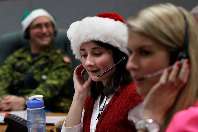 NORAD volunteers tracking Santa in 2013.