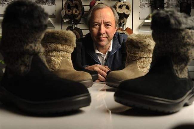 
FILE - In this Wednesday, Dec. 14, 2011, file photo, Crocs CEO John McCarvel poses for a photo at the Pearl Street Mall Crocs store in Boulder, Colo. Crocs shoes is getting a $200 million bailout from private equity fund Blackstone and CEO McCarvel is retiring in April 2014, according to reports Monday, Dec. 30, 2013.