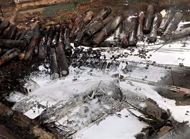 The downtown core lays in ruins as firefighters continue to water smouldering rubble July 7, 2013 in Lac-Mégantic, Quebec. THE CANADIAN PRESS/Ryan Remiorz