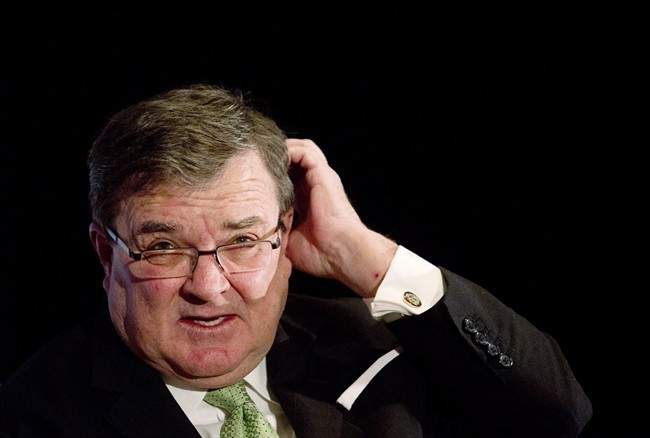 Federal Finance Minister Jim Flaherty delivers an update of economic and fiscal projections in Edmonton on November 12, 2013. 