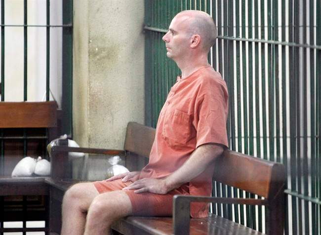 Canadian Christopher Paul Neil sits in the cell at criminal court in Bangkok, Thailand Friday, Aug. 15, 2008. THE CANADIAN PRESS/AP,Sakchai Lalit.