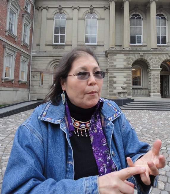 Marcia Brown Martel speaks outside Osgoode Hall in Toronto, Wednesday, Dec.4, 2013. She is the representative plaintiff in a class action lawsuit that claims a devastating loss of cultural identity was suffered by Ontario victims of the so-called "60s scoop.".