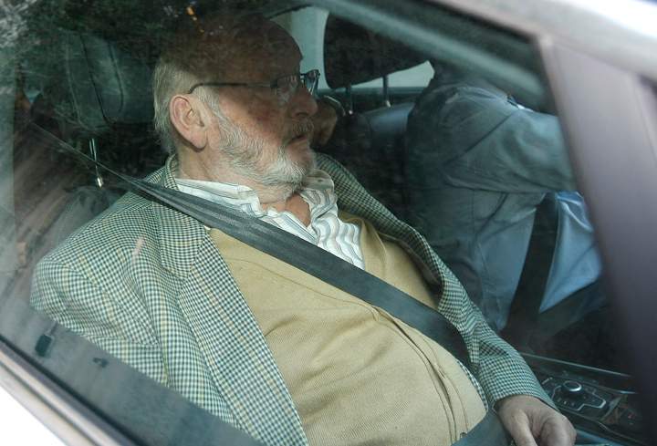 Jean-Claude Mas, the founder of Poly Implant Prothese, leaves the courthouse of Marseille, southern France, Tuesday, Dec. 10, 2013. 